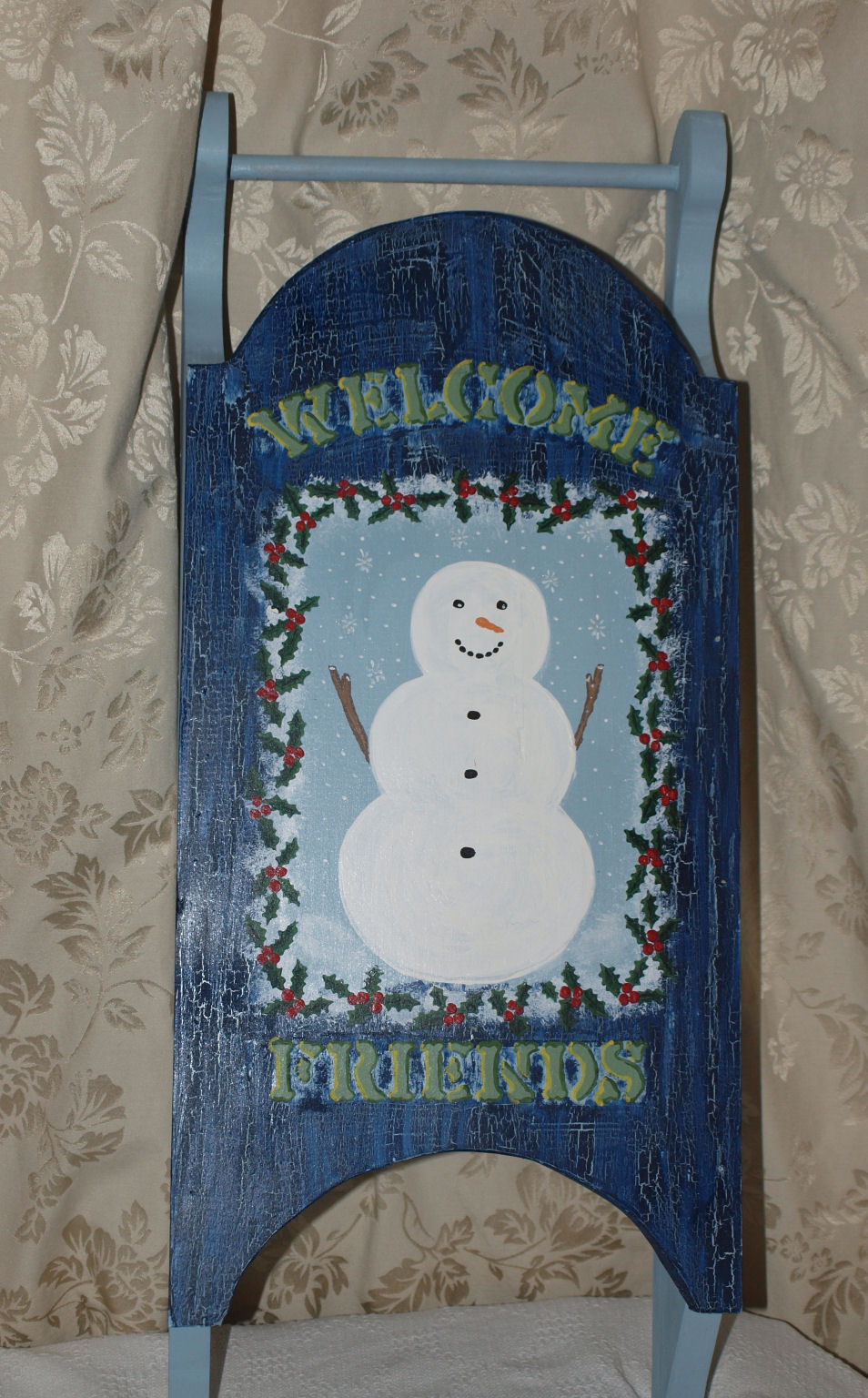 Snowman painted on sled